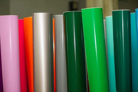Vinyl car wrapping or plotter cutting sticker foil film rolls. Film colored i Stock Photos