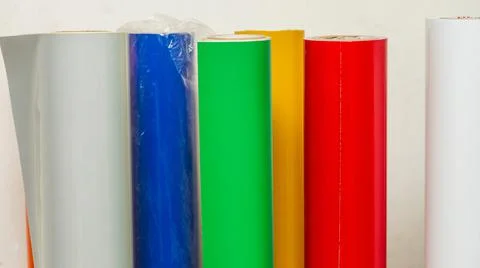 Vinyl car wrapping or plotter cutting sticker foil film rolls. Film colored i Stock Photos