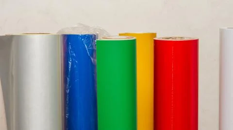 Vinyl car wrapping or plotter cutting sticker foil film rolls. Film colored i Stock Photos