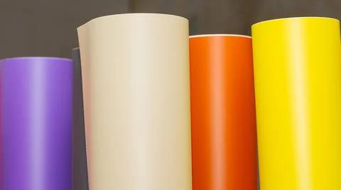 Vinyl car wrapping or plotter cutting sticker foil film rolls. Film colored i Stock Photos