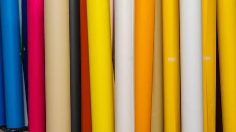 Vinyl car wrapping or plotter cutting sticker foil film rolls. Film colored i Stock Photos