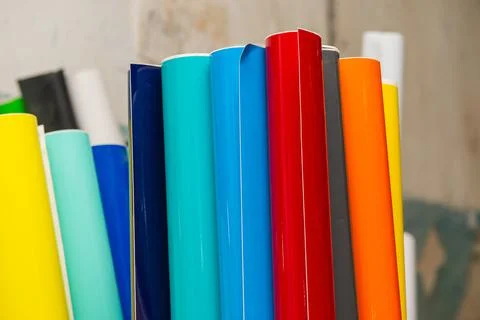 Vinyl car wrapping or plotter cutting sticker foil film rolls. Film colored i Stock Photos