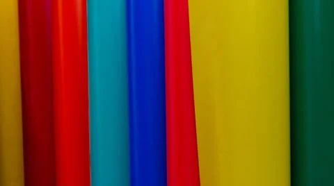 Vinyl car wrapping or plotter cutting sticker foil film rolls. Film colored i Stock Photos