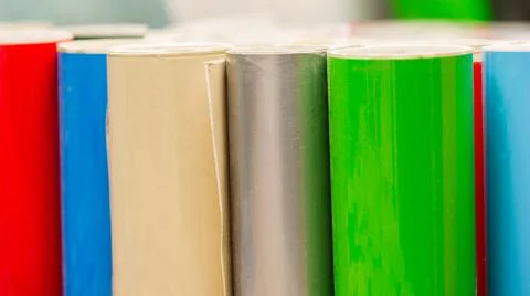 Vinyl car wrapping or plotter cutting sticker foil film rolls. Film colored i Stock Photos