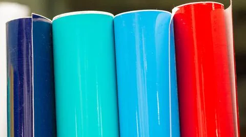 Vinyl car wrapping or plotter cutting sticker foil film rolls. Film colored i Stock Photos