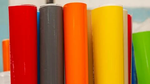 Vinyl car wrapping or plotter cutting sticker foil film rolls. Film colored i Stock Photos