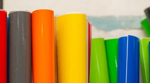 Vinyl car wrapping or plotter cutting sticker foil film rolls. Film colored i Stock Photos