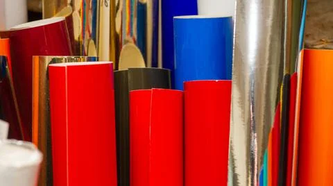 Vinyl car wrapping or plotter cutting sticker foil film rolls. Film colored i Stock Photos