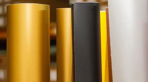 Vinyl car wrapping or plotter cutting sticker foil film rolls. Film colored i Stock Photos
