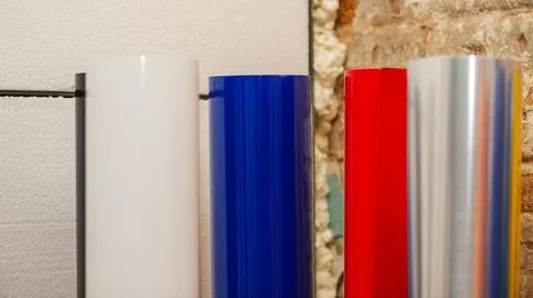 Vinyl car wrapping or plotter cutting sticker foil film rolls. Film colored i Stock Photos
