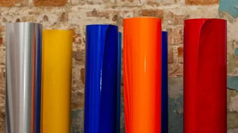 Vinyl car wrapping or plotter cutting sticker foil film rolls. Film colored i Stock Photos