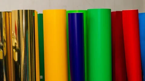Vinyl car wrapping or plotter cutting sticker foil film rolls. Film colored i Stock Photos