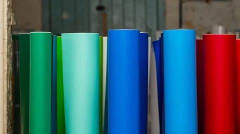 Vinyl car wrapping or plotter cutting sticker foil film rolls. Film colored i Stock Photos