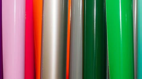 Vinyl car wrapping or plotter cutting sticker foil film rolls. Film colored i Stock Photos