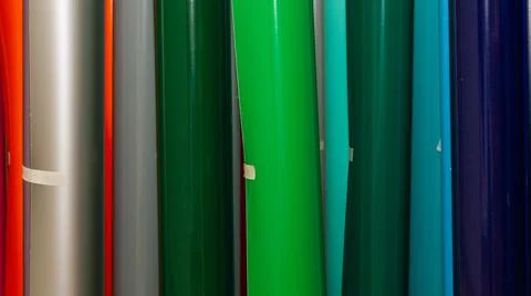 Vinyl car wrapping or plotter cutting sticker foil film rolls. Film colored i Stock Photos