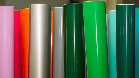 Vinyl car wrapping or plotter cutting sticker foil film rolls. Film colored i Stock Photos