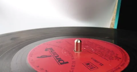 Vinyl disc on analog adapter, macro shot Stock Footage 146515099