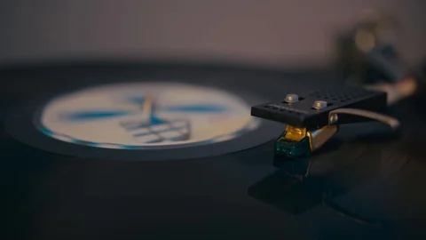 A vinyl disc on the turntable, record player, closeup Video stock 128424723