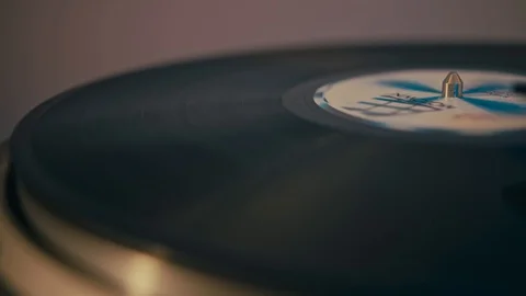 A vinyl disc on the turntable, record player, closeup panning Video stock 128424779
