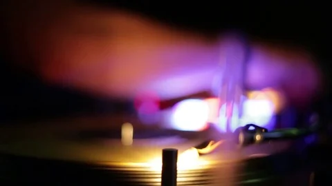 Vinyl dj arm in action - rotating disc in a club - Dj playing music at mixer Stock Footage 84888281