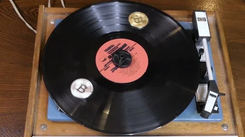 Vinyl plate with bitcoins is spinning Stock Footage 84844983