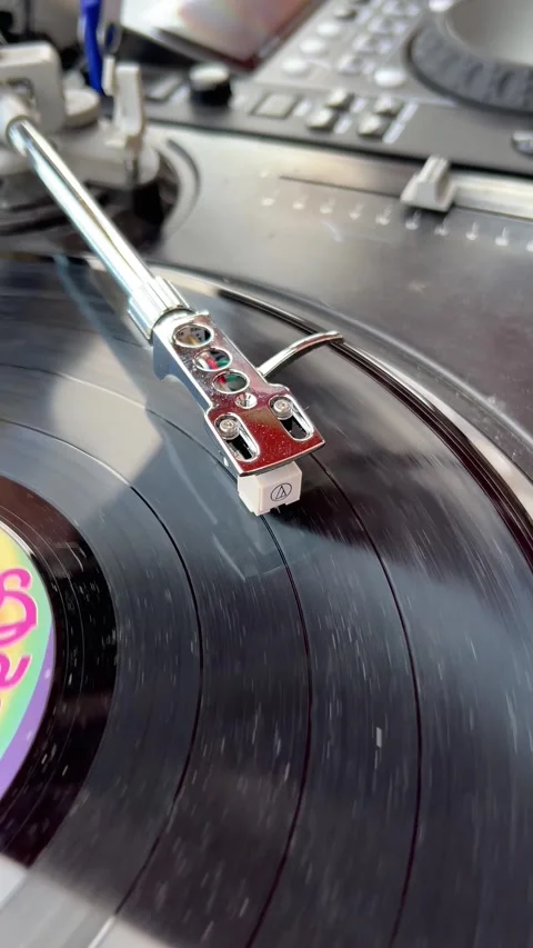 Vinyl player on long play or LP which rotates on a platter of a turntable. Stock Footage 298357783