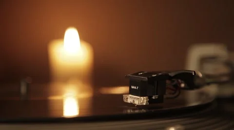 Vinyl player. spinning disk. vinyl record is spinning. intimate atmosphere. Video stock 45948212