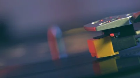 Vinyl player turntable. Slide rotating plate, needle, blurry bright bokeh lights Stock Footage 91683319