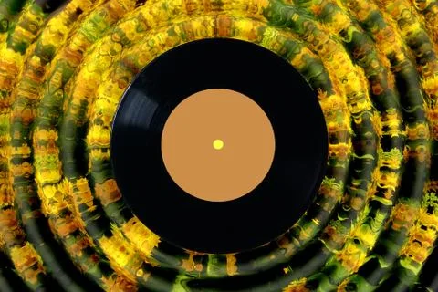 Vinyl record on abstract yellow background. melodies of autumn. Stock Photos