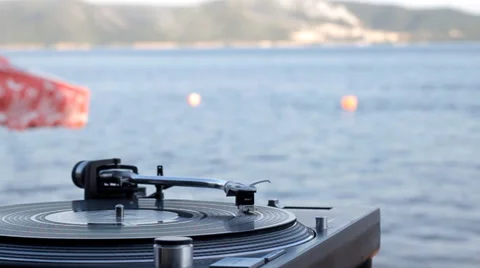 Vinyl record on the beach Stock Footage 51770454
