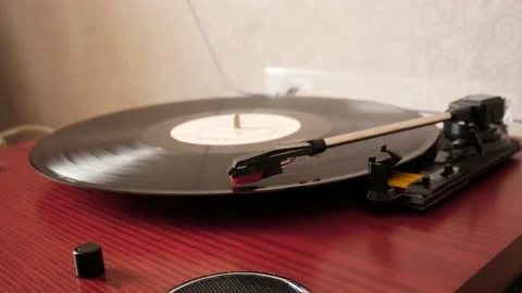 A vinyl record circle is rotating. 動画素材 217934733