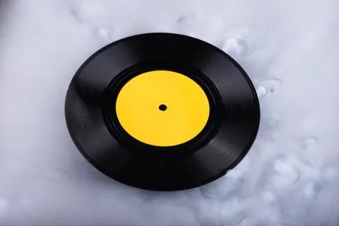 Vinyl record  in clouds. Conceptual image. Retro sound Stock Photos