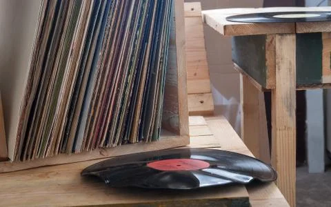 Vinyl record with copy space in front of a collection albums dummy titles Stock Photos