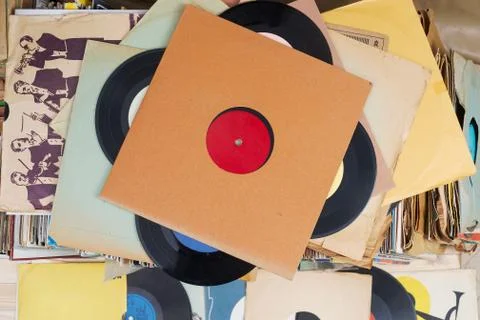 Vinyl record with copy space in front of a collection albums dummy titles Stock Photos