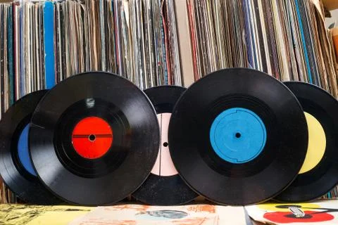 Vinyl record with copy space in front of a collection albums dummy titles Stock Photos