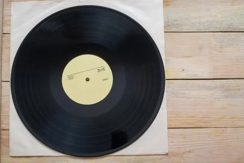 Vinyl record with copy space in front of a collection of albums dummy titles Stock Photos