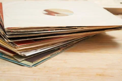 Vinyl record with copy space in front of a collection of albums dummy titles Stock Photos