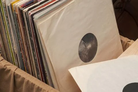 Vinyl record with copy space in front of a collection of albums dummy titles Stock Photos