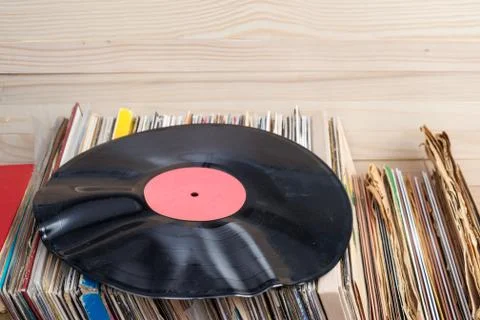 Vinyl record with copy space in front of a collection of albums dummy titles Stock Photos