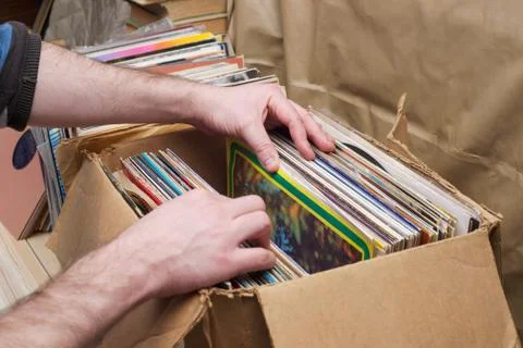 Vinyl record with copy space in front of a collection of albums dummy titles Stock Photos