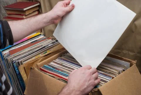 Vinyl record with copy space in front of a collection of albums dummy titles Stock Photos