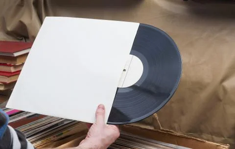 Vinyl record with copy space in front of a collection of albums dummy titles Stock Photos