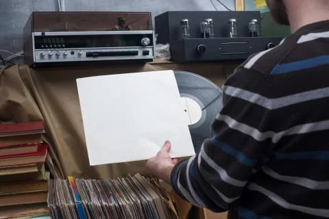 Vinyl record with copy space in front of a collection of albums dummy titles Stock Photos