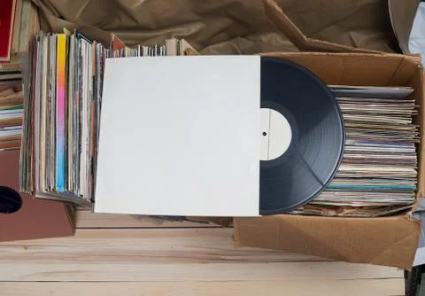 Vinyl record with copy space in front of a collection of albums dummy titles Stock Photos