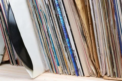 Vinyl record with copy space in front of a collection of albums dummy titles Stock Photos