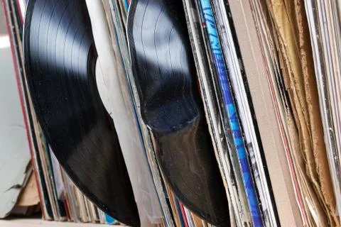 Vinyl record with copy space in front of a collection of albums dummy titles Stock Photos