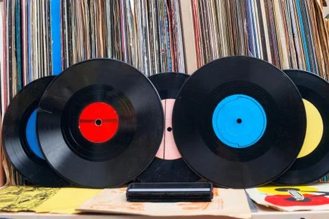 Vinyl record with copy space in front of a collection of albums dummy titles Stock Photos