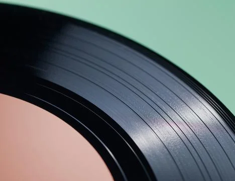 Vinyl Record Grooves with Light Reflection on Green Background Foto stock