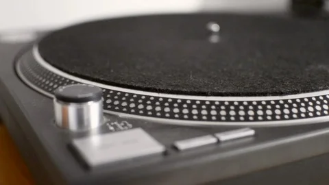 Vinyl record placed on turntable and start pressed Stock Footage 88976186