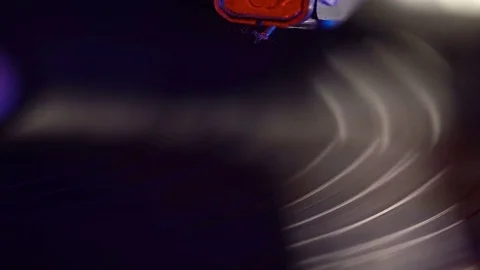 Vinyl record player, bright lights disco-bokeh. Needle on vinyl record. Stock-Footage 85353366